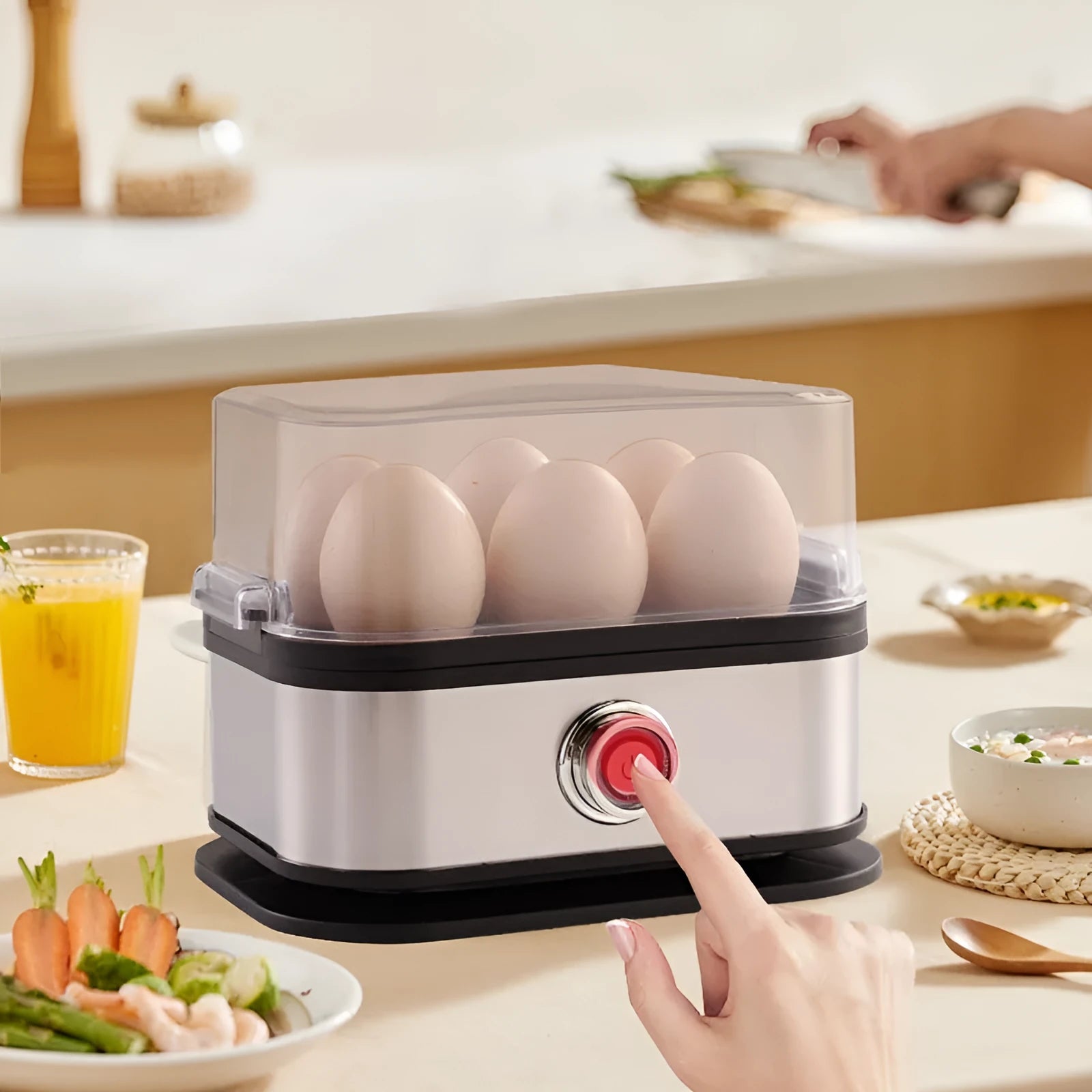 Black portable stainless steel mini egg boiler for kitchen and travel use.
