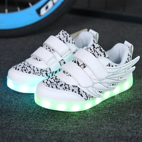 Children's plum red LED light-up sneakers with USB charging port and colourful luminous soles.