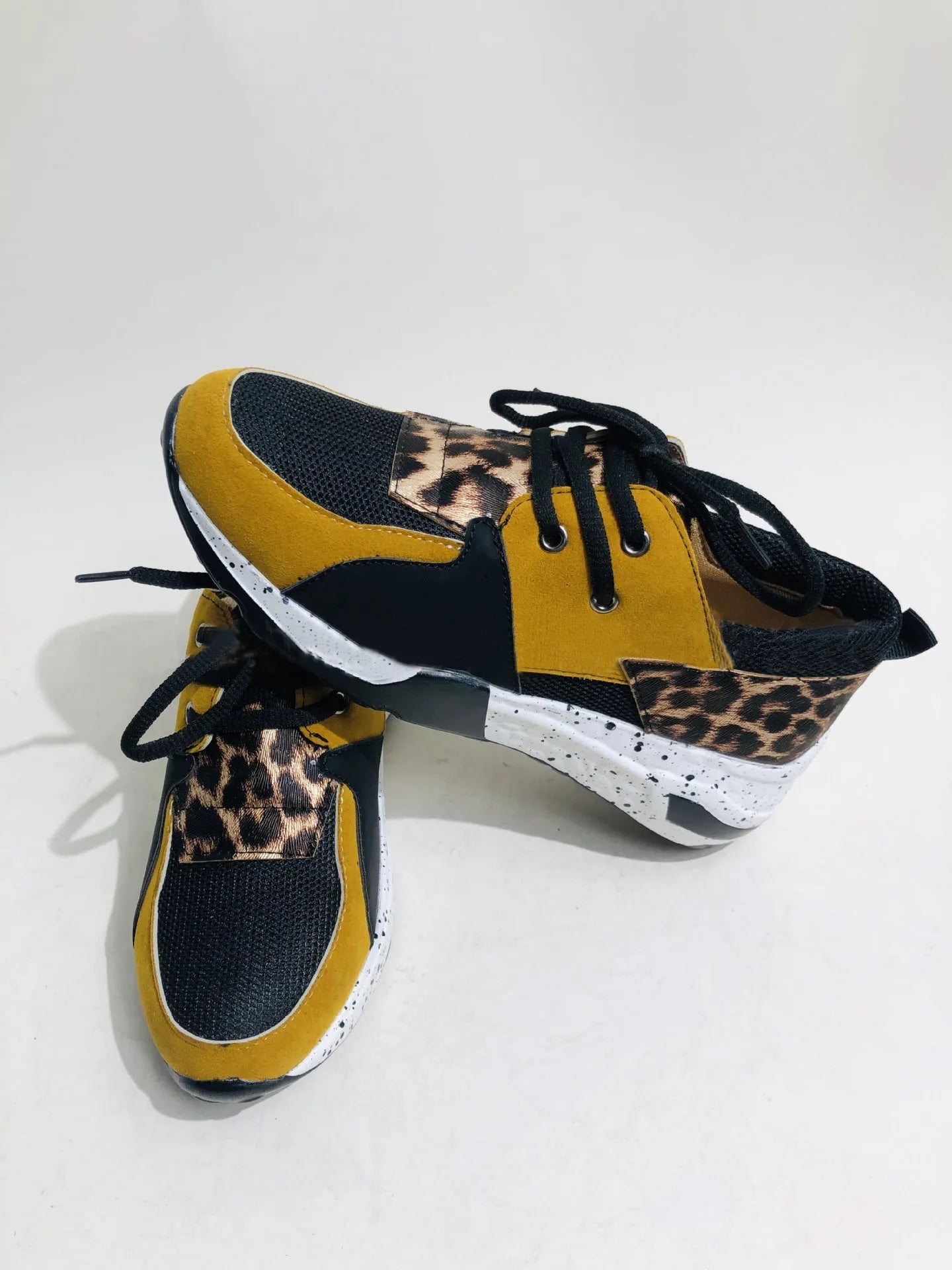 Women's suede casual sneakers with wedge heel in leopard print and snake pattern designs