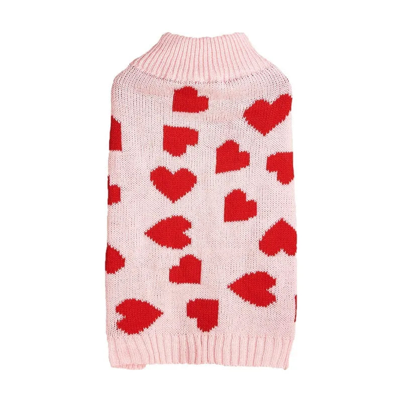 Red love heart design dog sweater on a small dog, showing acrylic knit fabric and playful motif.