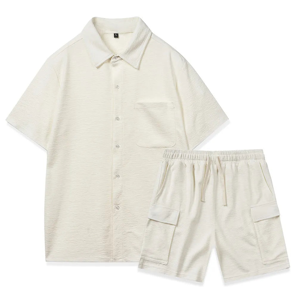 Beige polyester short sleeve top and elastic waist shorts two-piece set laid flat.