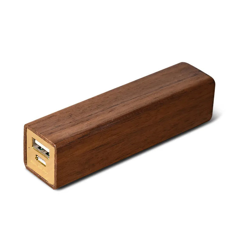 Brown walnut wood portable power bank showing its rectangular shape and natural wood grain.