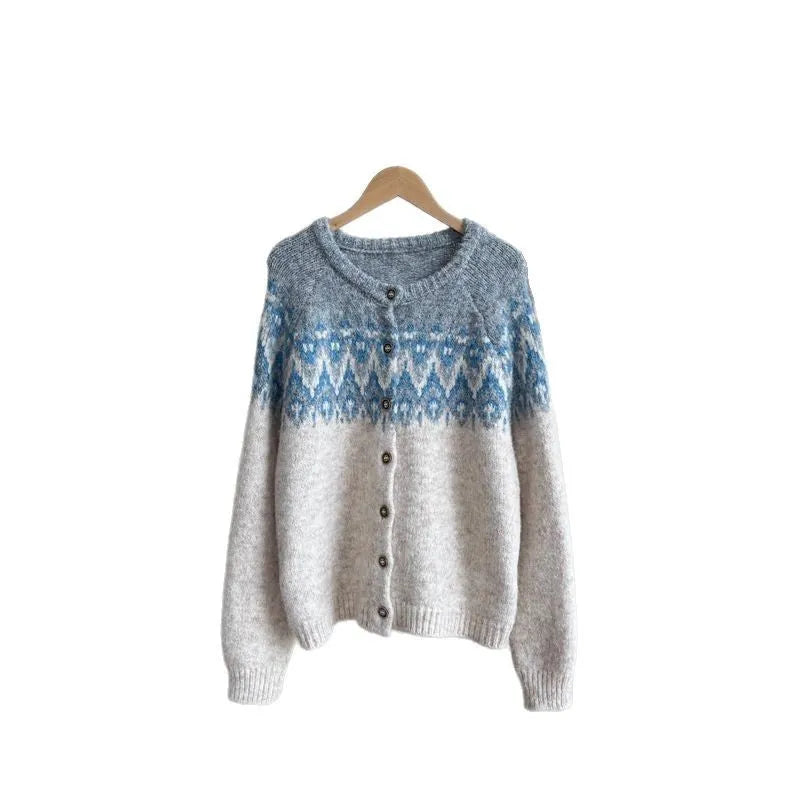 Women's thick jacquard knit sweater coat in a loose fit, shown in milky white colour with long sleeves.