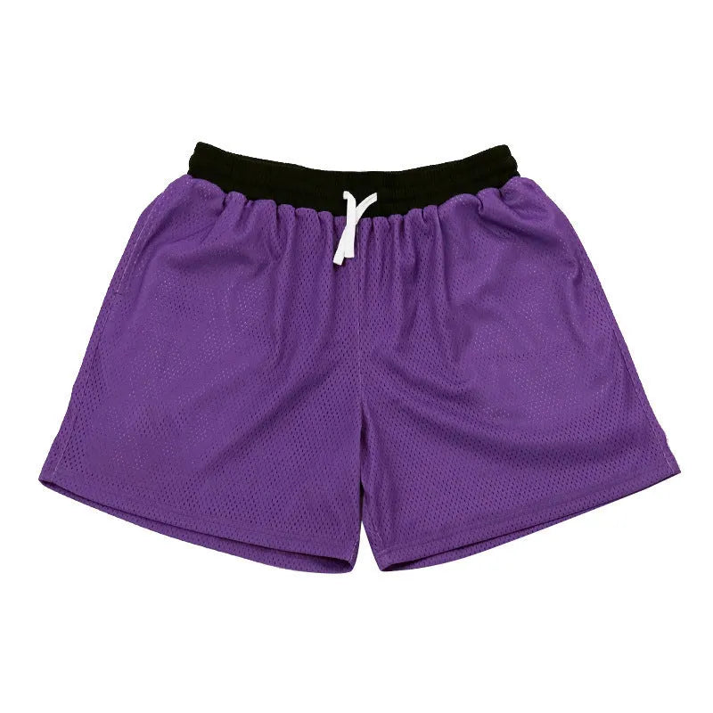 Men's mesh quick-drying shorts in solid colours for running and fitness.