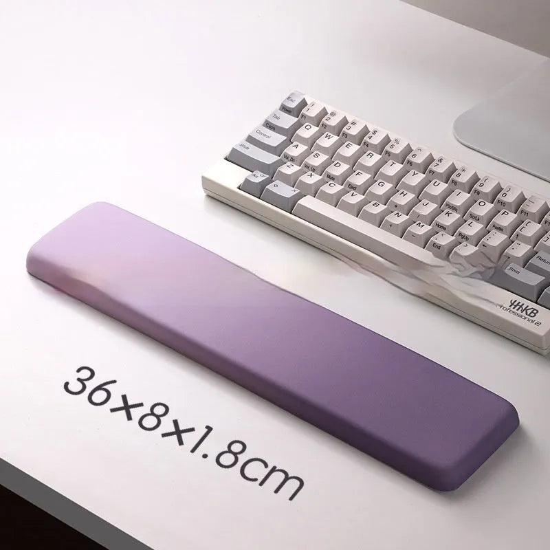 Square silicone wrist rest mouse pad with wrist strap in multiple colour options on a desk