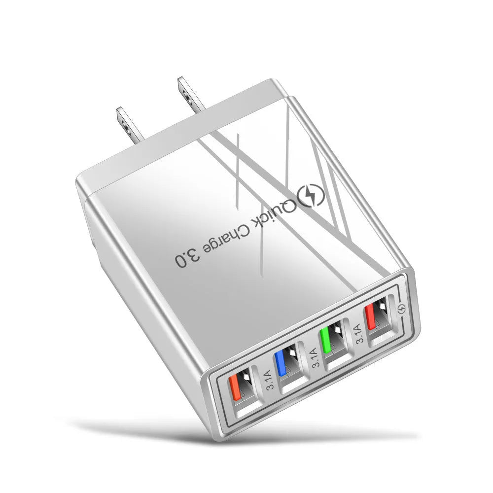 Dark blue 4-port USB wall charger with EU plug next to mobile phone