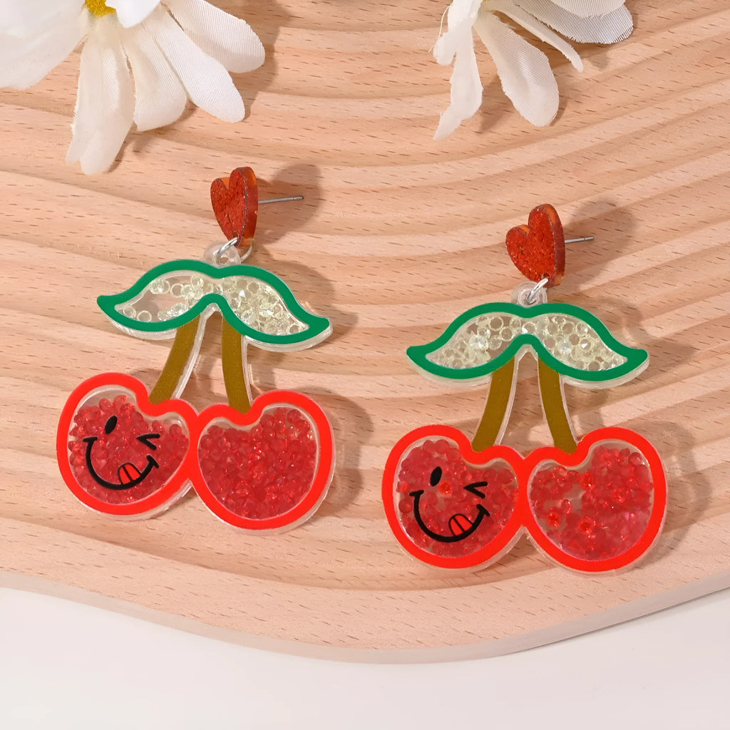 Colourful acrylic fruit and ice cream dangle earrings for women on a white background.