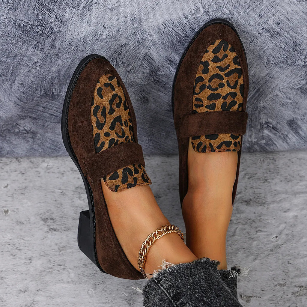 Leopard print suede slip-on pump with chunky heel in brown, shown from the side.