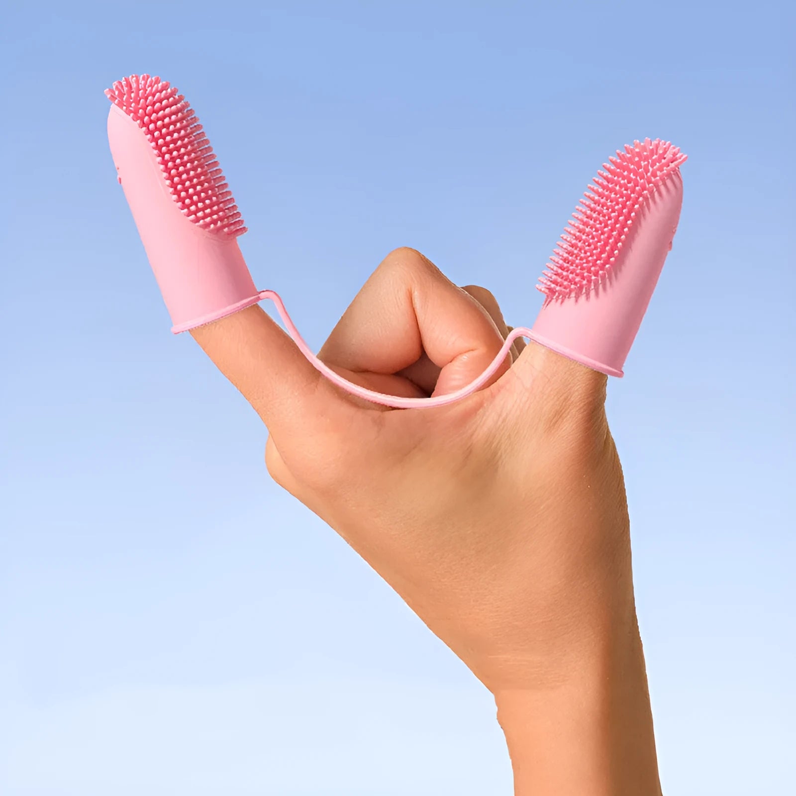 TPR double finger pet toothbrush in pink, blue green, and yellow for dog and cat dental care.