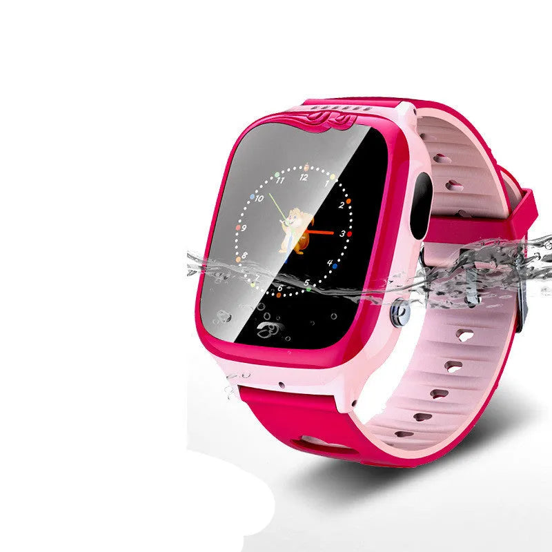 Children's smartwatch with pink silicone wristband showing HD touch screen and camera