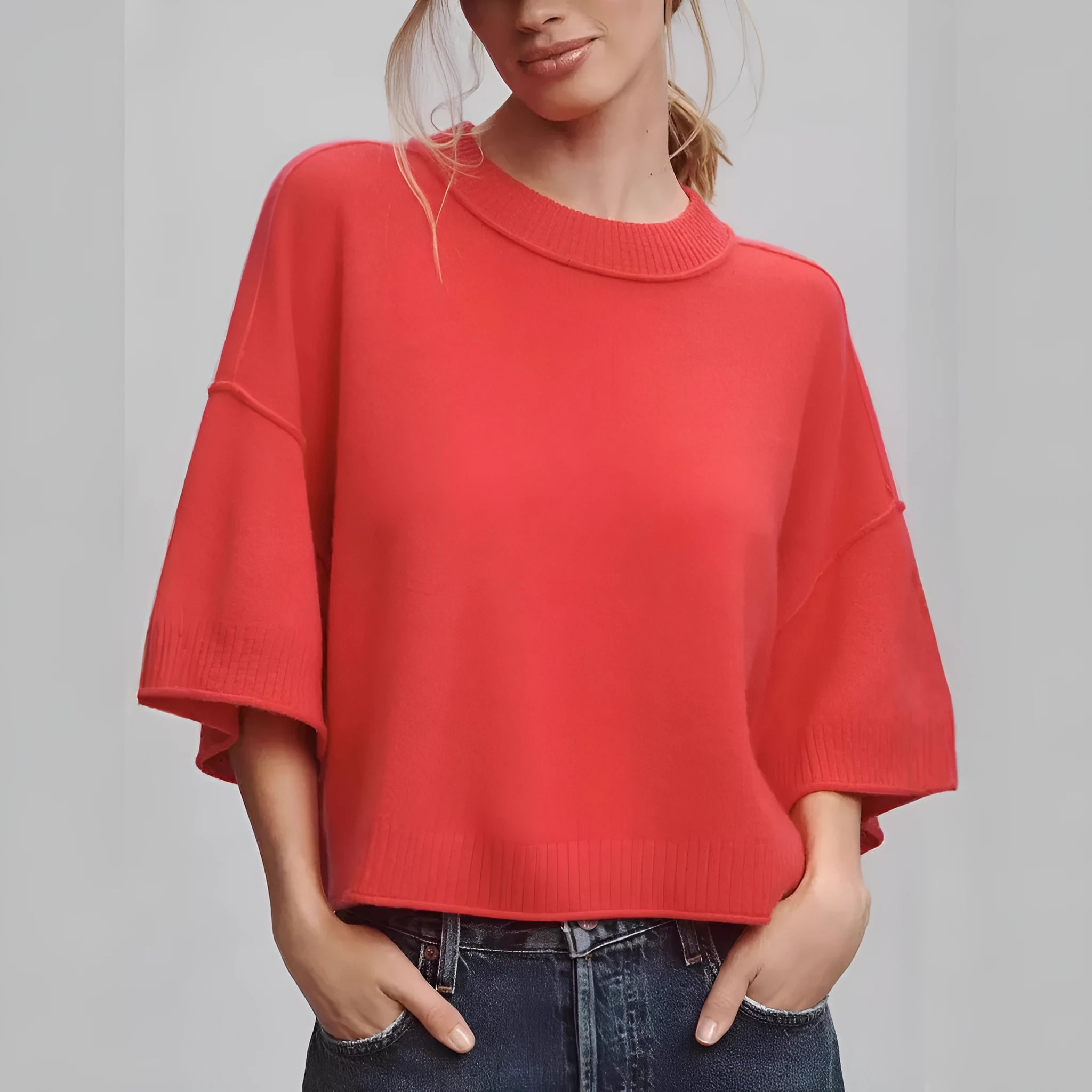 Red short sleeve viscose T-shirt with an exposed navel crop design on a model.
