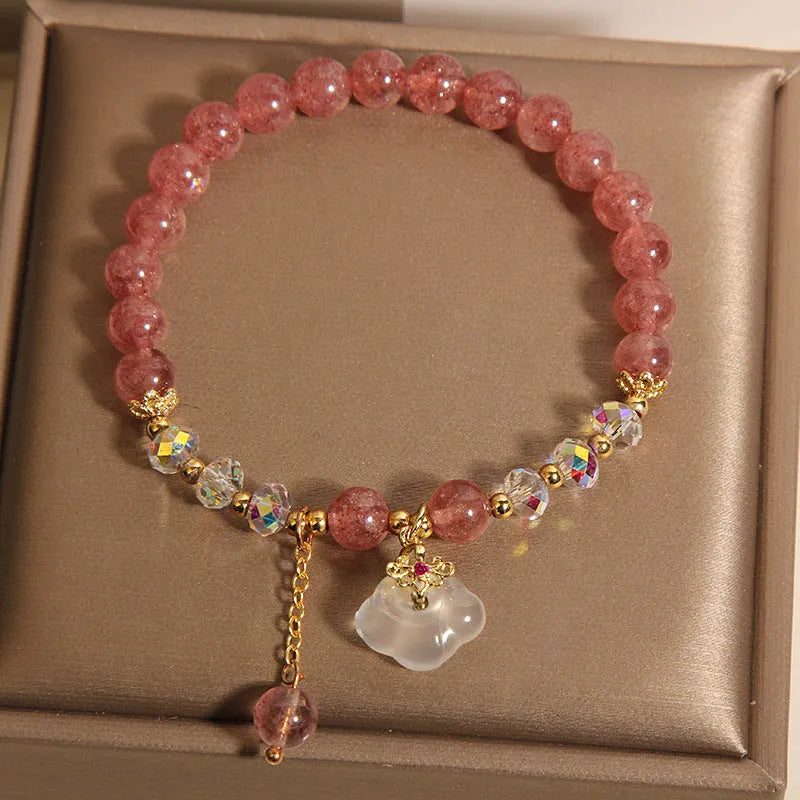 Women's adjustable crystal bracelet with strawberry quartz and white agate beads showing adjustable chain detail
