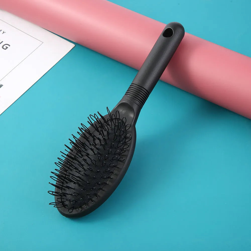 Black ring tooth hair extension comb made from ABS plastic measuring 22cm by 6cm