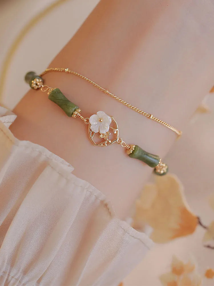 Natural olivine bracelet with double layer twin bells of Ireland design and olive branch elements