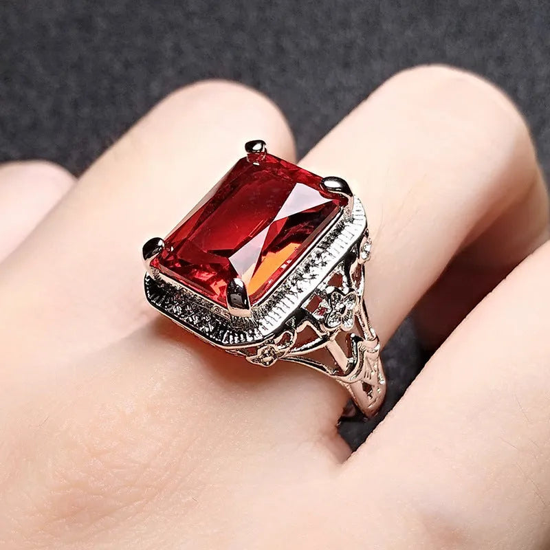 Women's adjustable copper ring with a geometric design and a central stone setting.