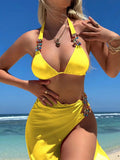 Rose red mesh long skirt three-piece bikini swimsuit set laid flat.