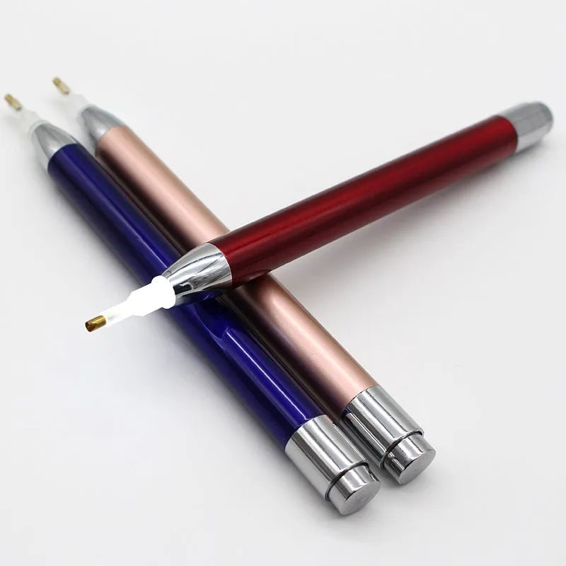 Aluminium alloy luminous drill pen for diamond painting in gold, red, or blue colour.