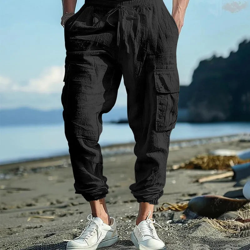 Men's linen casual trousers with ankle-tied design and multiple pockets in army green colour.