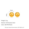 Stainless steel ball stud earrings in gold and silver finishes on a grey background.
