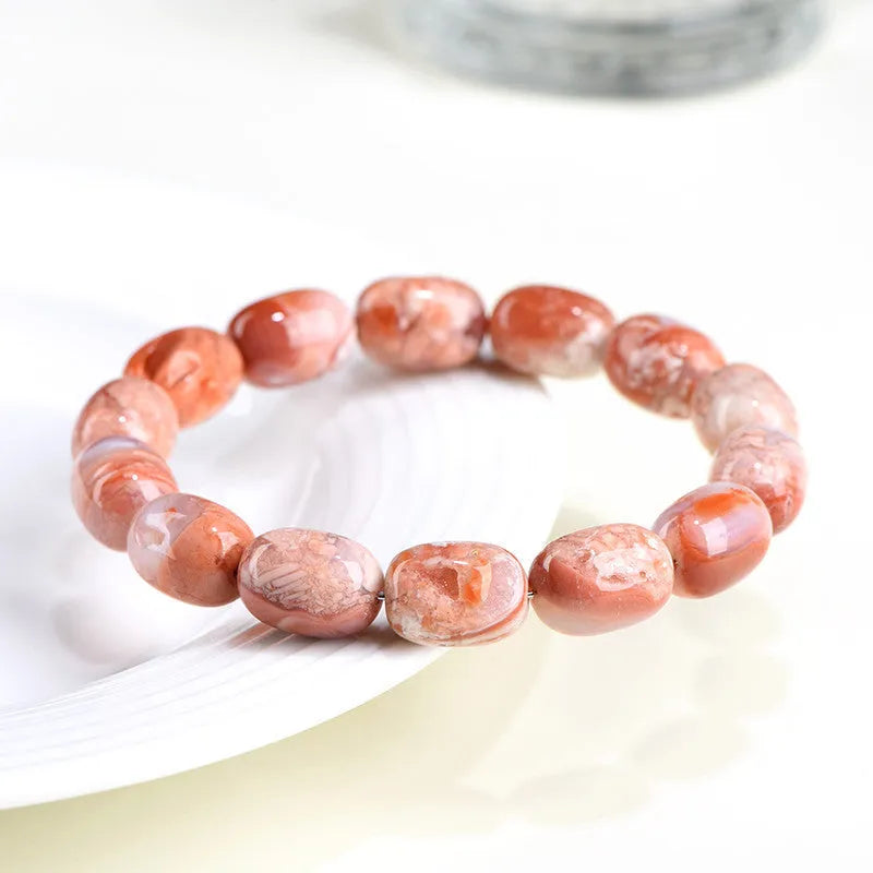 Natural cherry agate bracelet with 10x14mm barrel beads and traditional Ruyi design elements