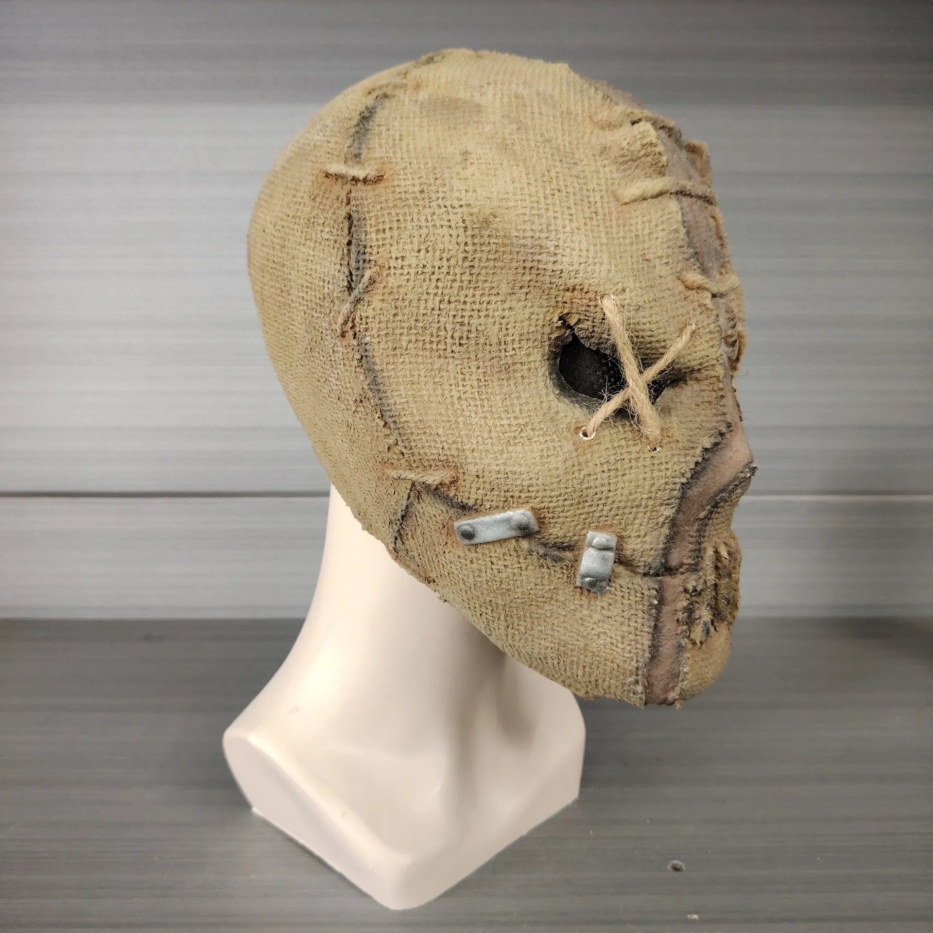 Scarred skull latex mask for adult Halloween costumes showing detailed scar texture