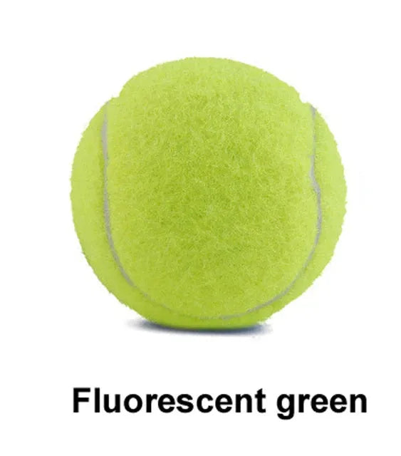 6.3 cm diameter solid rubber dog tennis ball in assorted bright colours on a green lawn.