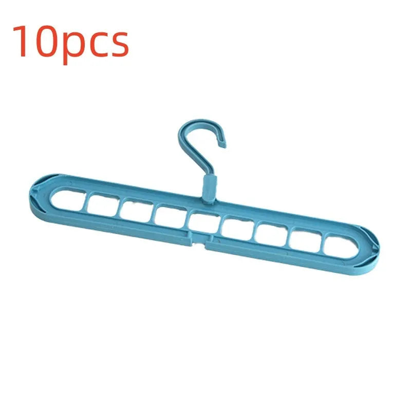 Green plastic nine-hole hanger folded flat showing multiple trouser hanging points