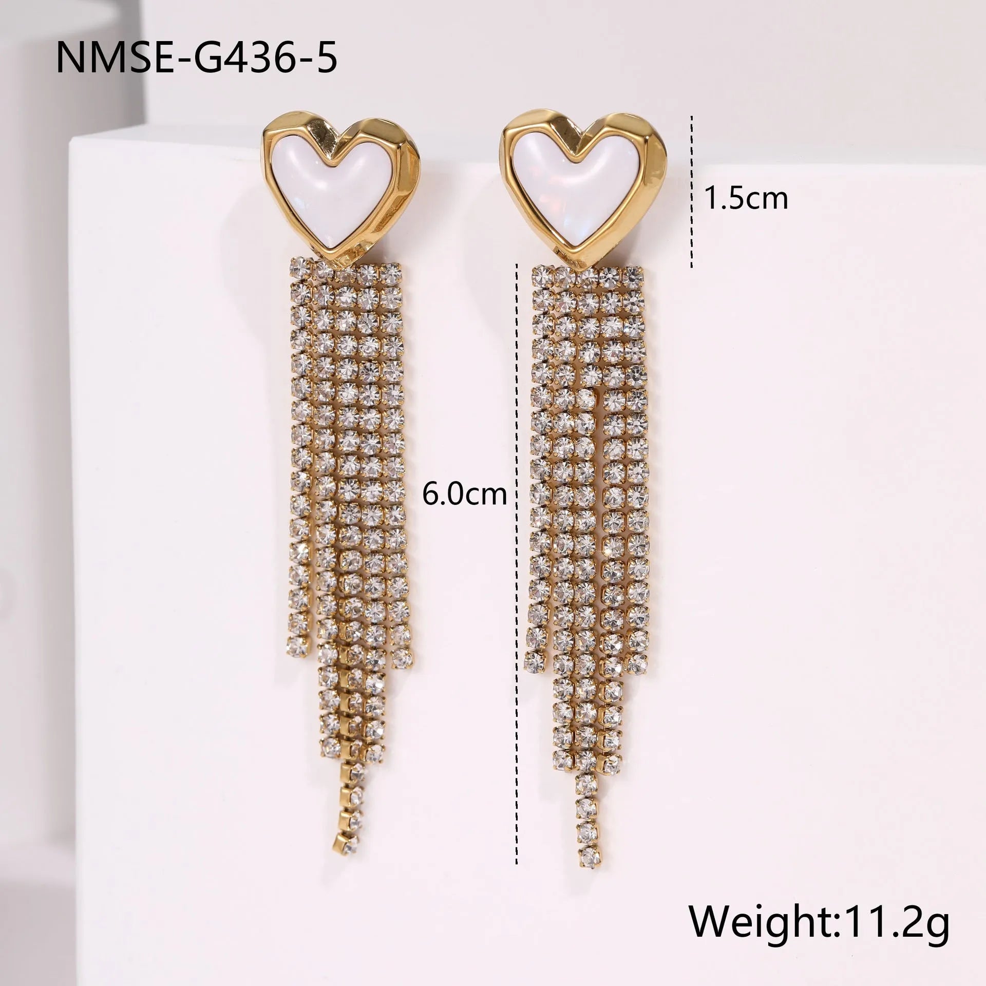 Stainless steel tassel earrings with 18K gold electroplated finish and diamond tips in heart and star shapes