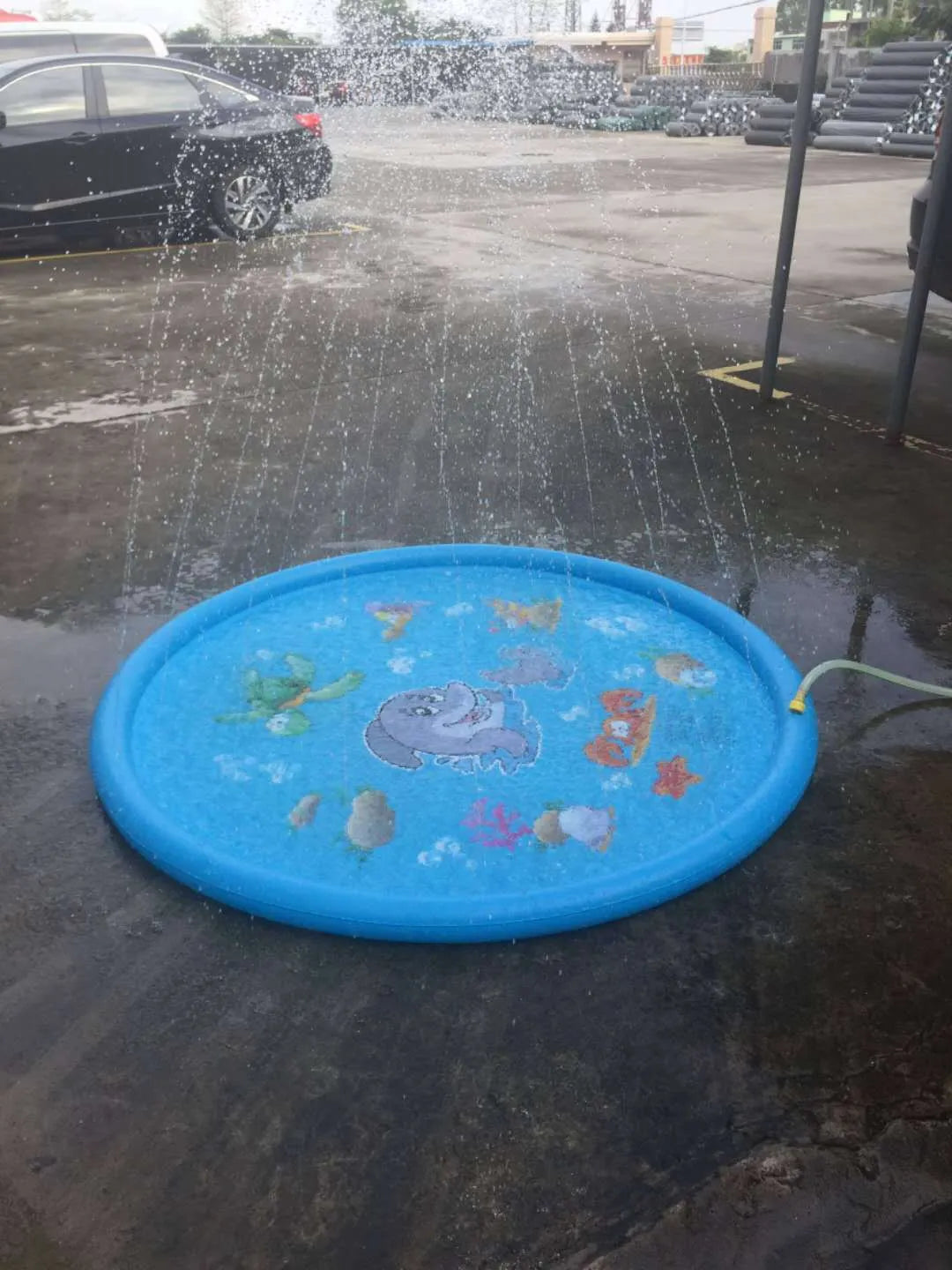 Children's water spray play mat with marine animal designs for outdoor garden use