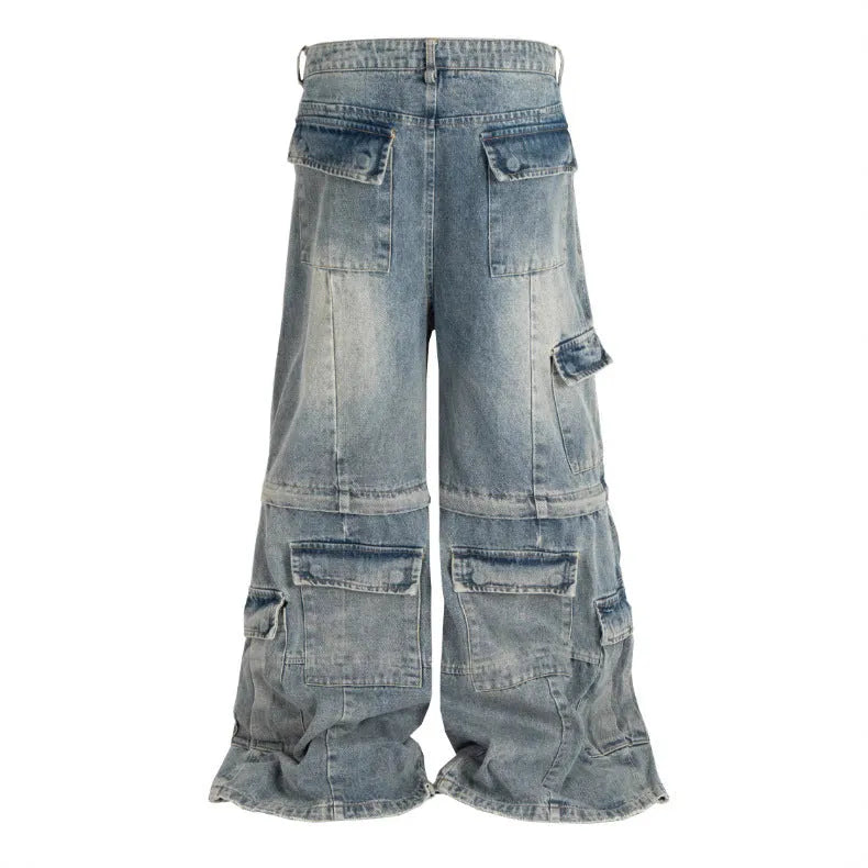 Black washed-out cotton overalls with multiple pockets and a detachable micro-pull design on a hanger.