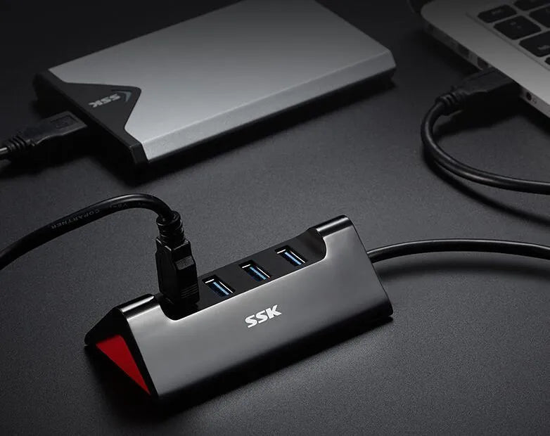 Black USB expansion dock with four ports and micro USB power connector