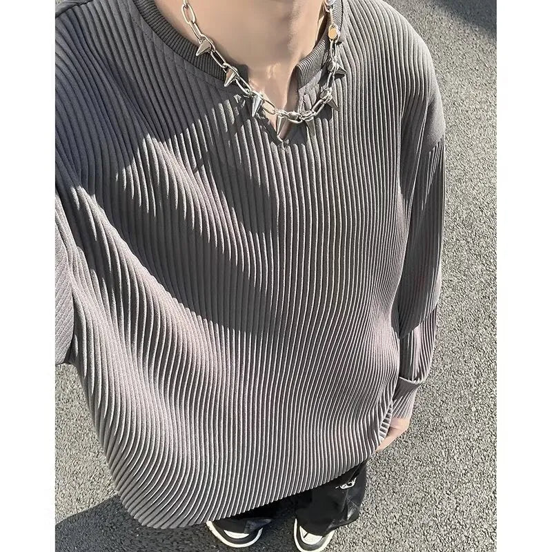 Women's plus size striped texture pullover top in grey, showing loose fit and long sleeves.