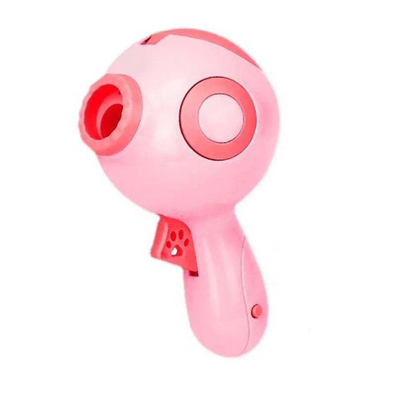 Green, orange, and pink dog treat launcher toy for interactive feeding and training