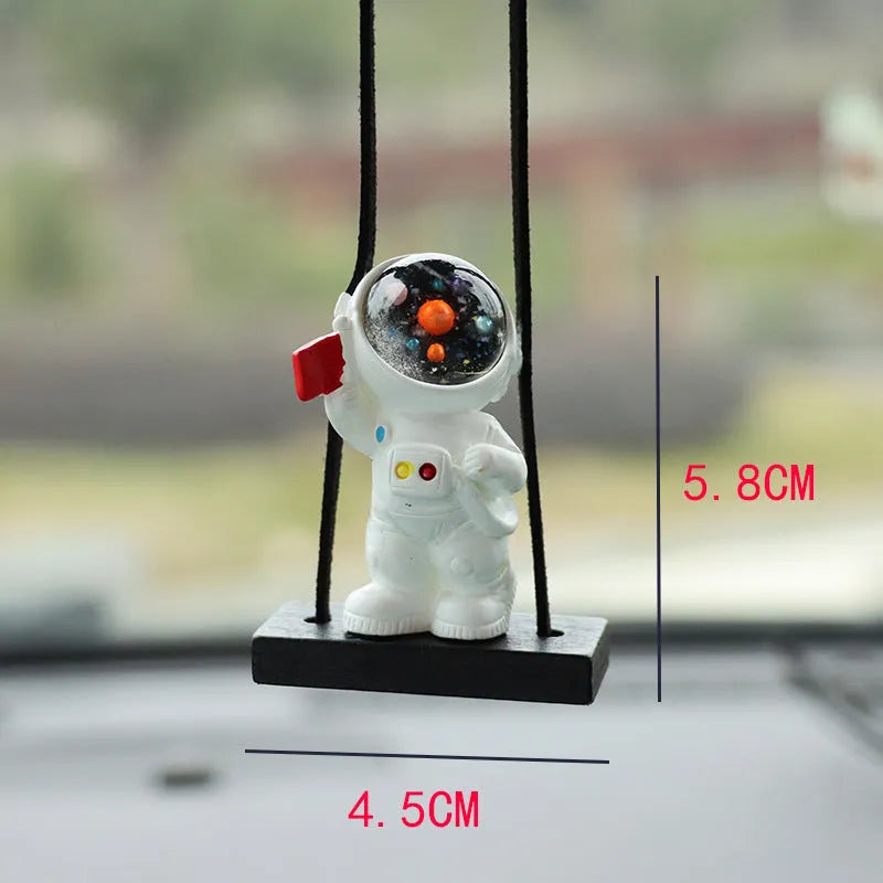 Resin cartoon astronaut car pendant available in red flag, telescope, and radish holding styles for dashboard decoration.