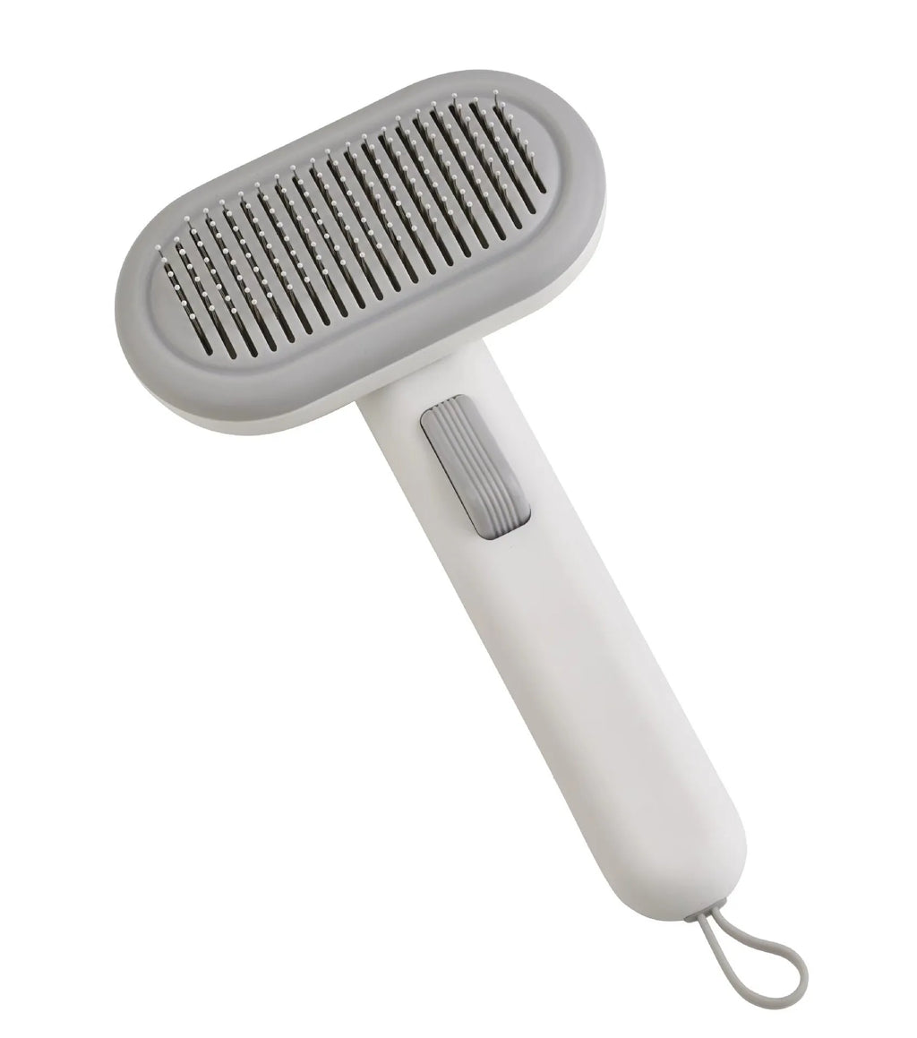 Large light grey pet hair removal comb for cats and dogs with stainless steel teeth and integrated de-matting shaver.