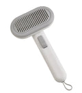 Large light grey pet hair removal comb for cats and dogs with stainless steel teeth and integrated de-matting shaver.