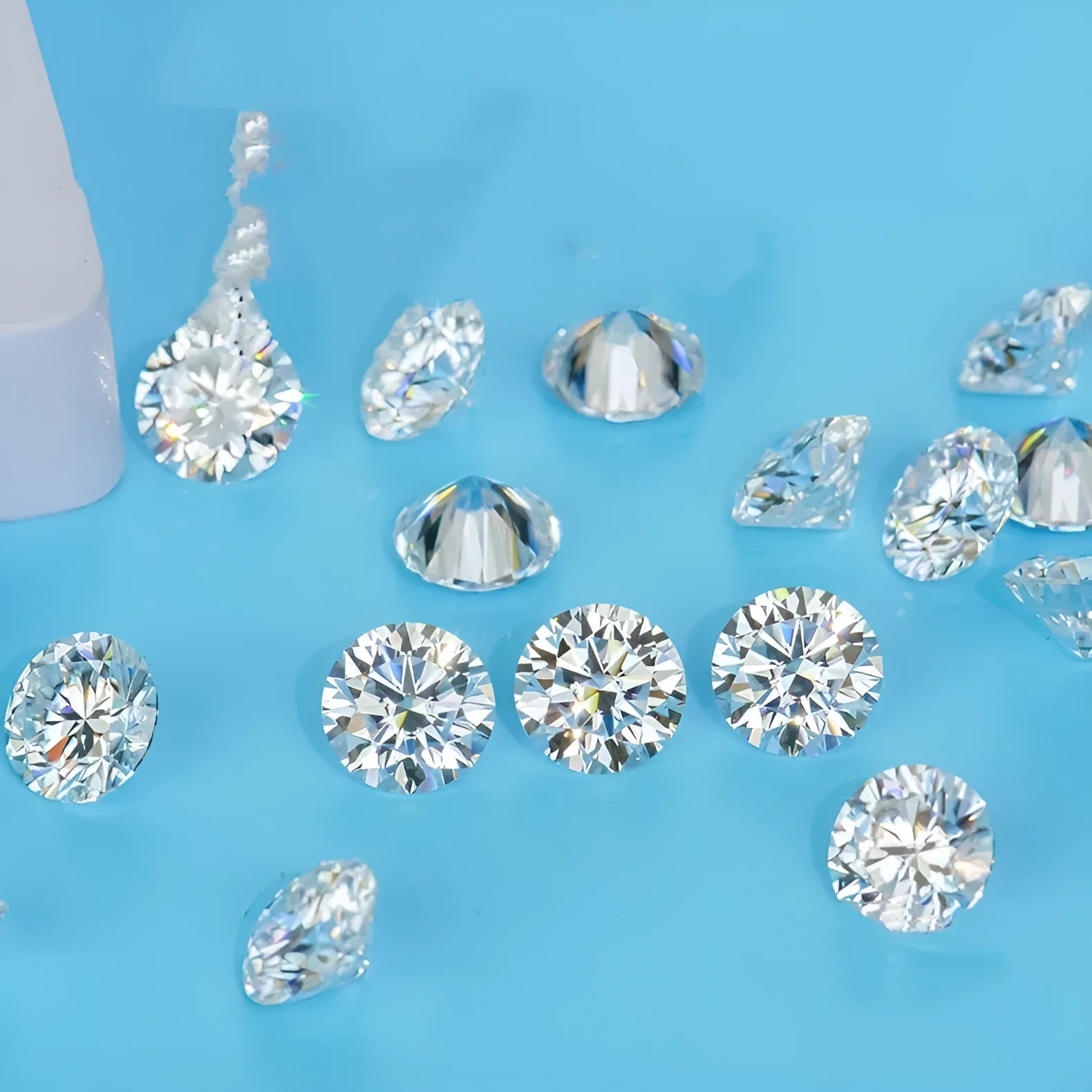 Round cut moissanite loose stone with eight hearts and eight arrows pattern on dark background