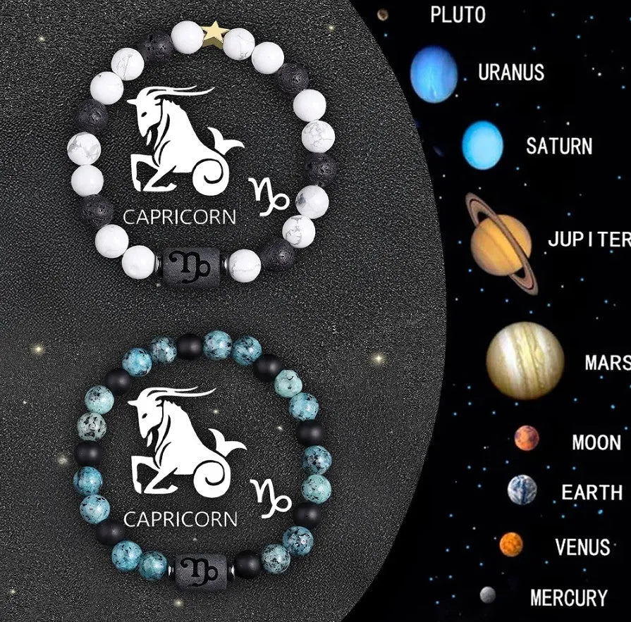 Two natural stone beaded zodiac bracelets with adjustable strings on wooden surface