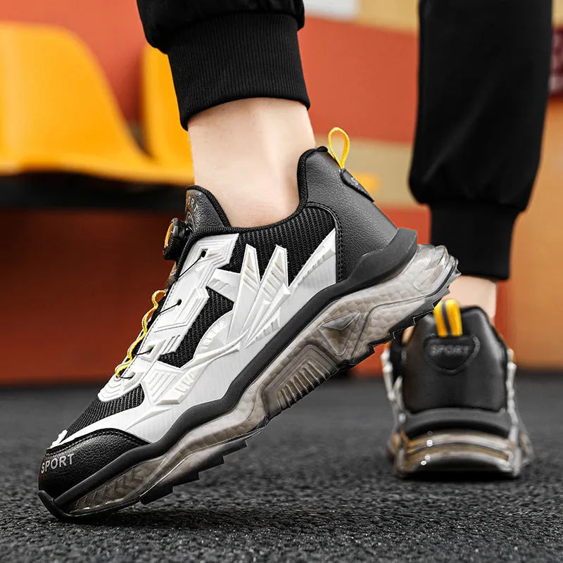 Men's black casual sneakers with a rotating button closure and low-top design.