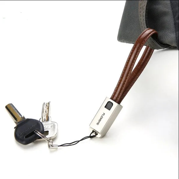 Short red leather and metal iPhone lightning charging cable showing 20cm length.
