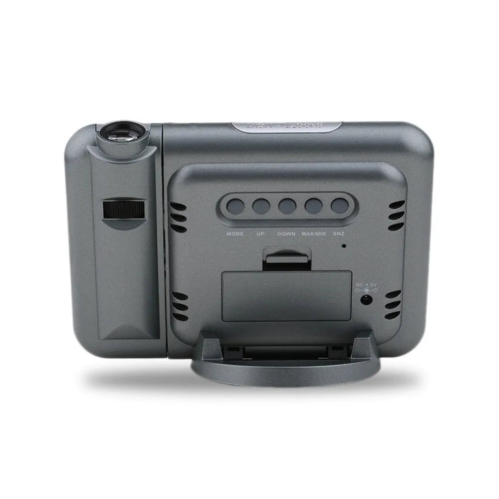 Black digital projection alarm clock with LED display showing time temperature humidity