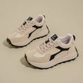 Women's solid-colour platform sneakers with mesh upper and flat rubber sole.