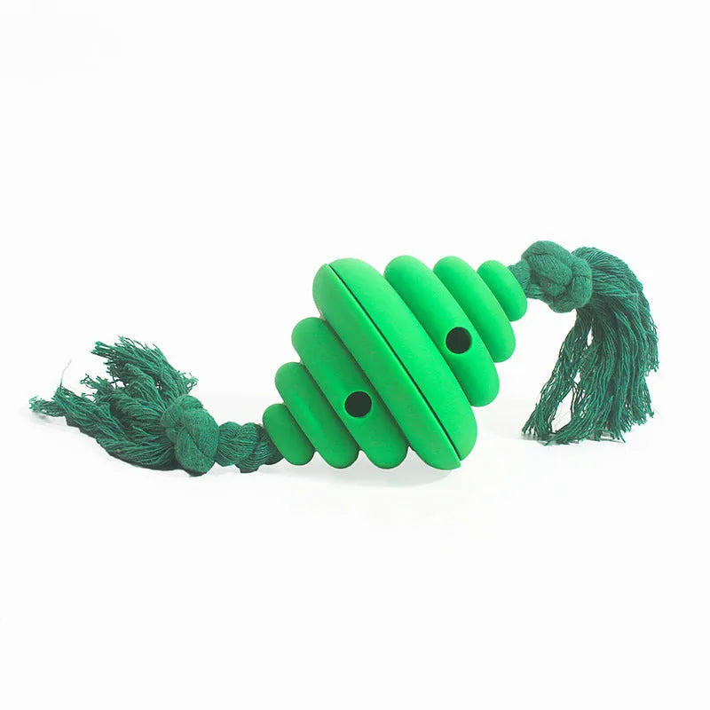 Green and yellow dog ball with attached rope for interactive play and food dispensing