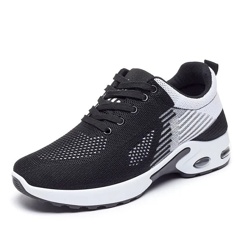 Women's Flyknit casual running shoes in pink with lace-up front and flat PVC sole.