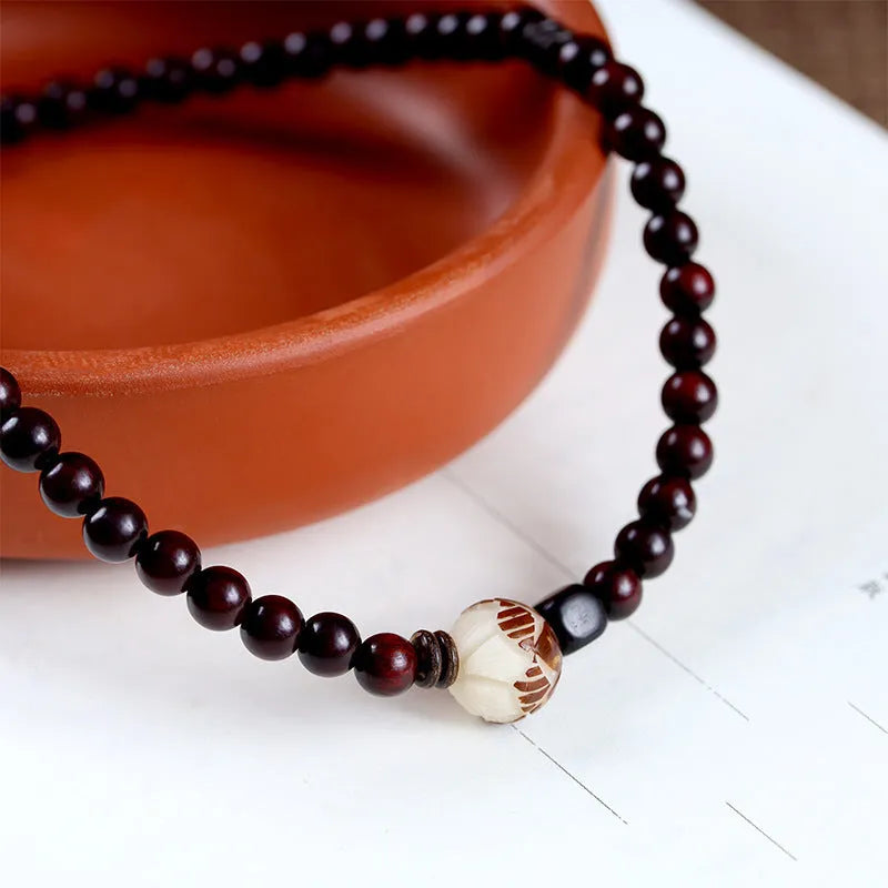 Natural rosewood double-ring bracelet with floral shape measuring 10mm wide, hand-knitted construction