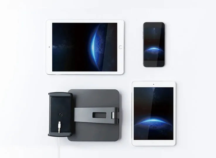 Silver aluminium and ABS folding stand holding a tablet, showing 360-degree rotation and anti-slip silicone pads.