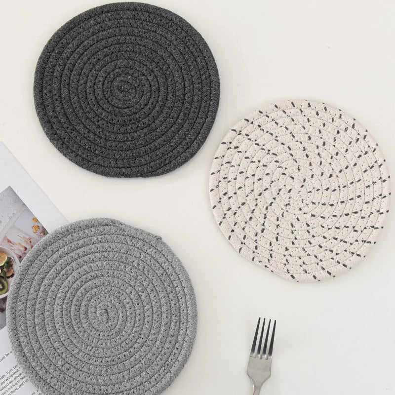 Cotton cord round coaster set showing three 18cm diameter placemats in modern colour options