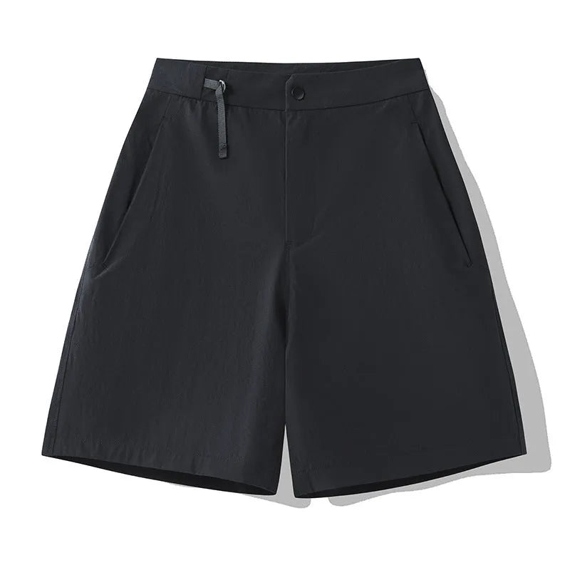 Men's solid colour quick-dry sports shorts with elastic waistband, shown in khaki.