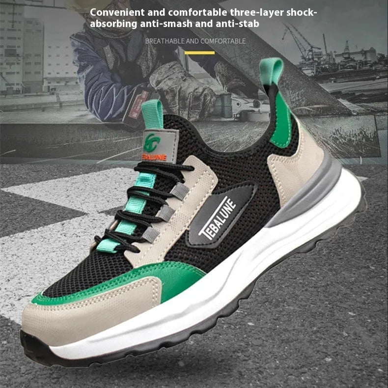Black and green low-top safety shoe with mesh upper and plastic steel toe cap on a white background.