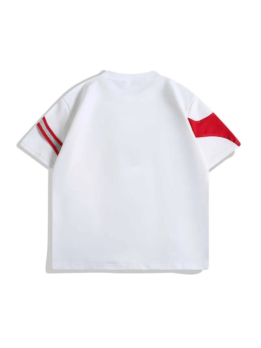 Loose fit black short sleeve T-shirt showing detail of double-layer stitched padded shoulder strap.